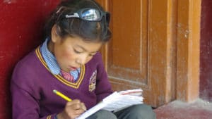 School girl and her notebook at the LMHS in Zanskar